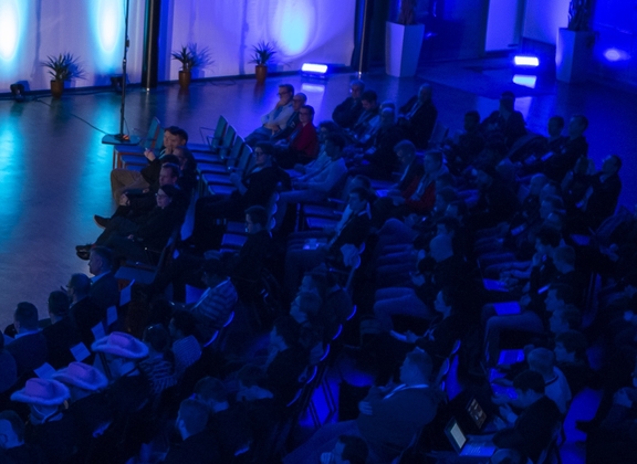 Seminar audience in a seminar hall, blue atmosphere